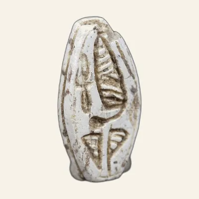 Reverse, of the Cauroid, for Steatite cauroid with uraeus and floral motifs – Ancient Egypt, New Kingdom (1550–1100 BC)...