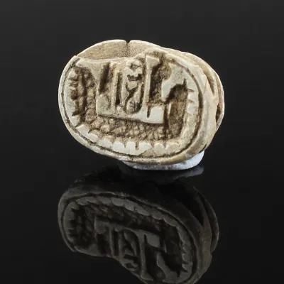 Obverse, for Egyptian — Scarab with solar boat above which a cartouche flanked by two Maat-feathers are depicted. Cartouche...