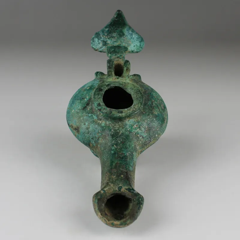 Obverse, for Greek, Hellenistic — Oil lamp. The handle is in the shape of a leaf and the lid as a seashell — 3rd - 2nd...