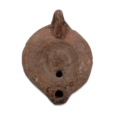 Obverse, for Roman — Oil lamp with a female head — 1st - 3rd Century A.D, 1st - 3rd Century A.D