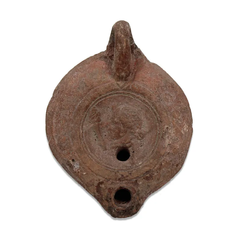 Obverse, for Roman — Oil lamp with a female head — 1st - 3rd Century A.D, 1st - 3rd Century A.D