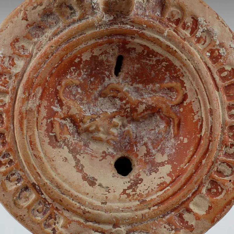 Avers, pour Romain — Lampe à huile with greyhounds and planta pedis, Type Bussière D X 1 — 2e - 3e siècle ap. J.-C., 2e - 3e...