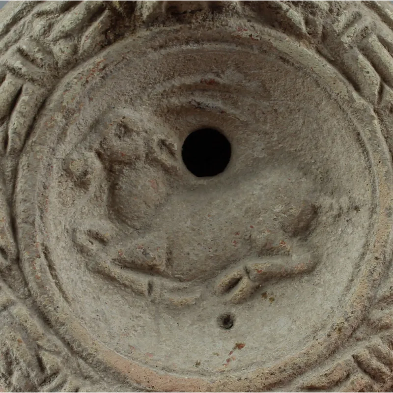 Avers, pour Romain — Factory Lampe à huile with reclining antelope and initials stamp, Type Bussière D X 4 — 175 - 250 ap....