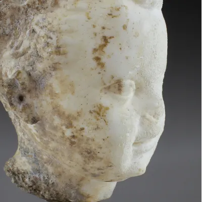 Obverse, for Roman — Portrait head of a laureated African child — 1st - 2nd Century A.D, 1st - 2nd Century A.D