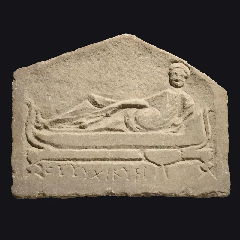 Avers, pour Romain — Funerary stele depicting a symposium with Greek inscription ‘Cheer up, Kyris’ — 3e siècle ap. J.-C., 3e...